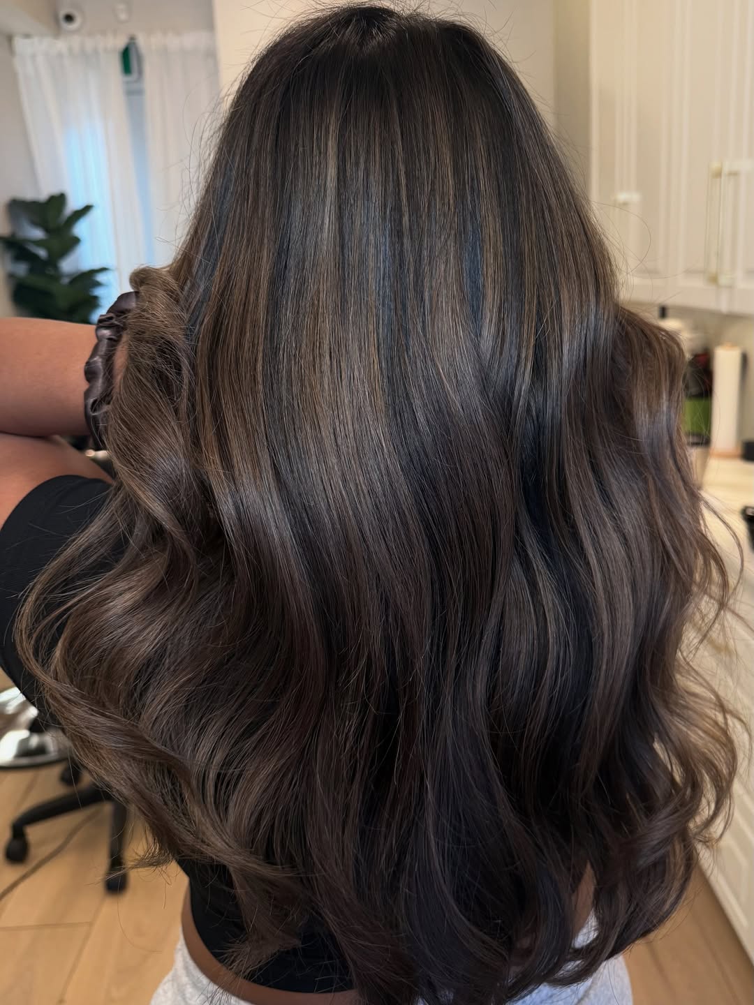 Rich Brunette With Subtle Caramel Highlights And Bouncy Waves