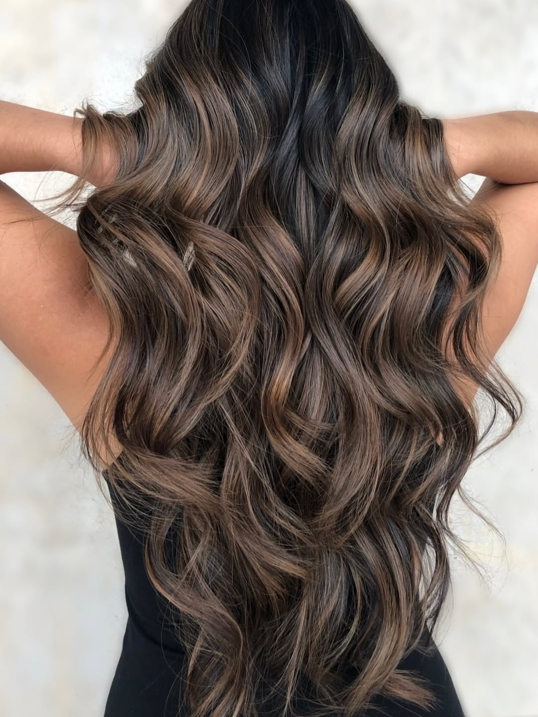 Rich Brunette With Warm Caramel Balayage Waves