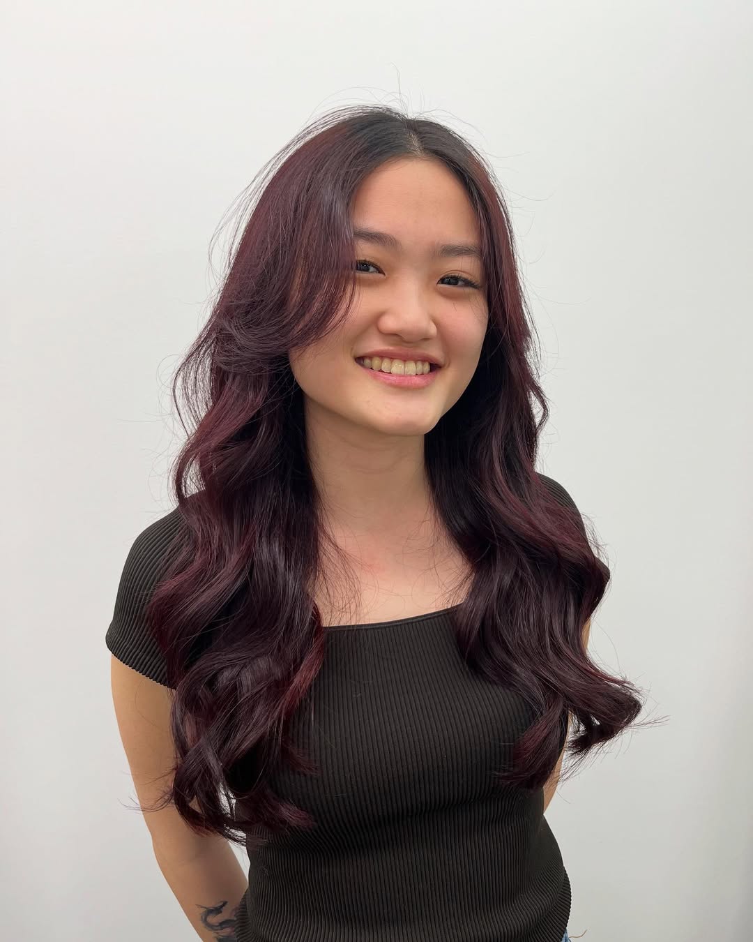 Rich Plum Long Layers With Soft Face Framing