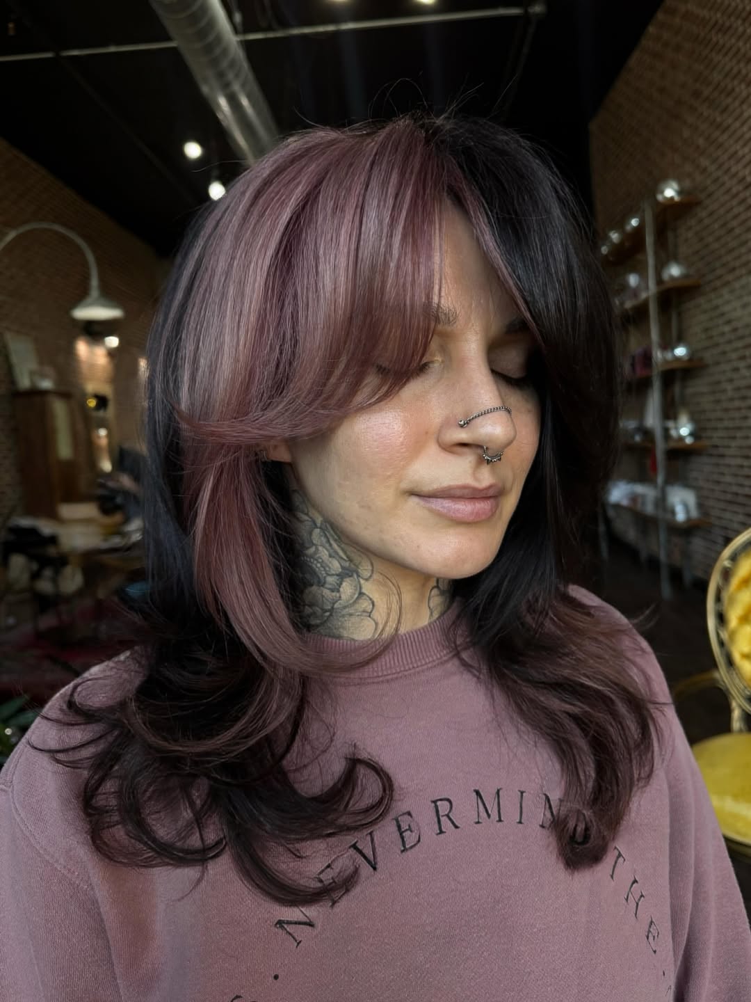 Rose Gold Streaked Layered Hair with Curtain Bangs