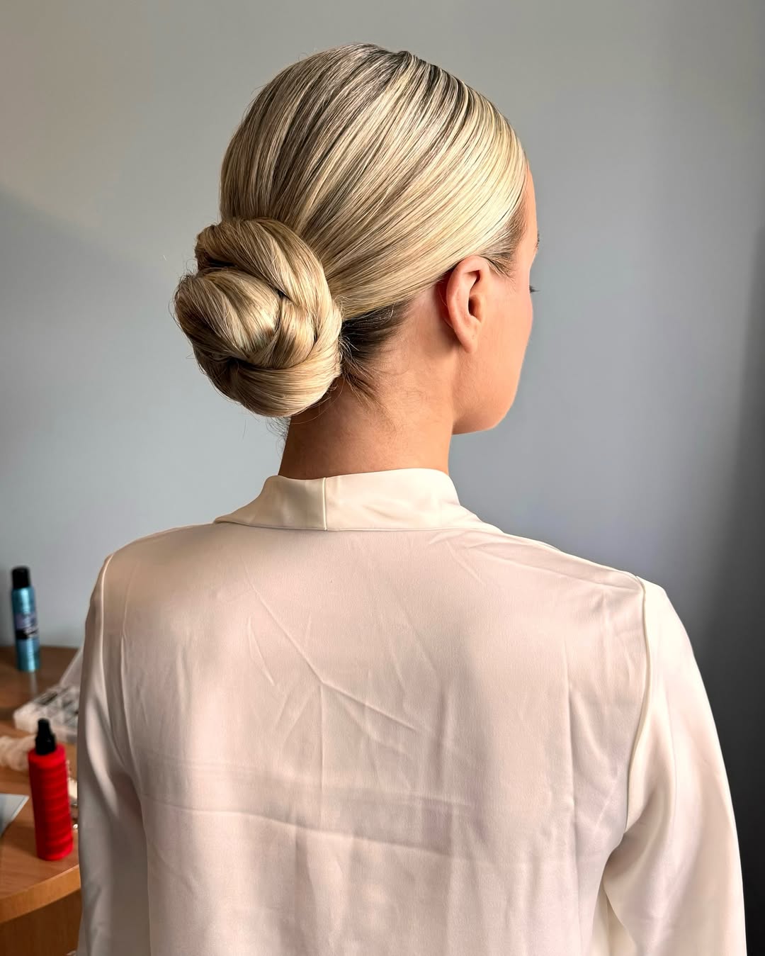Sleek and Polished Low Twisted Bun Blonde