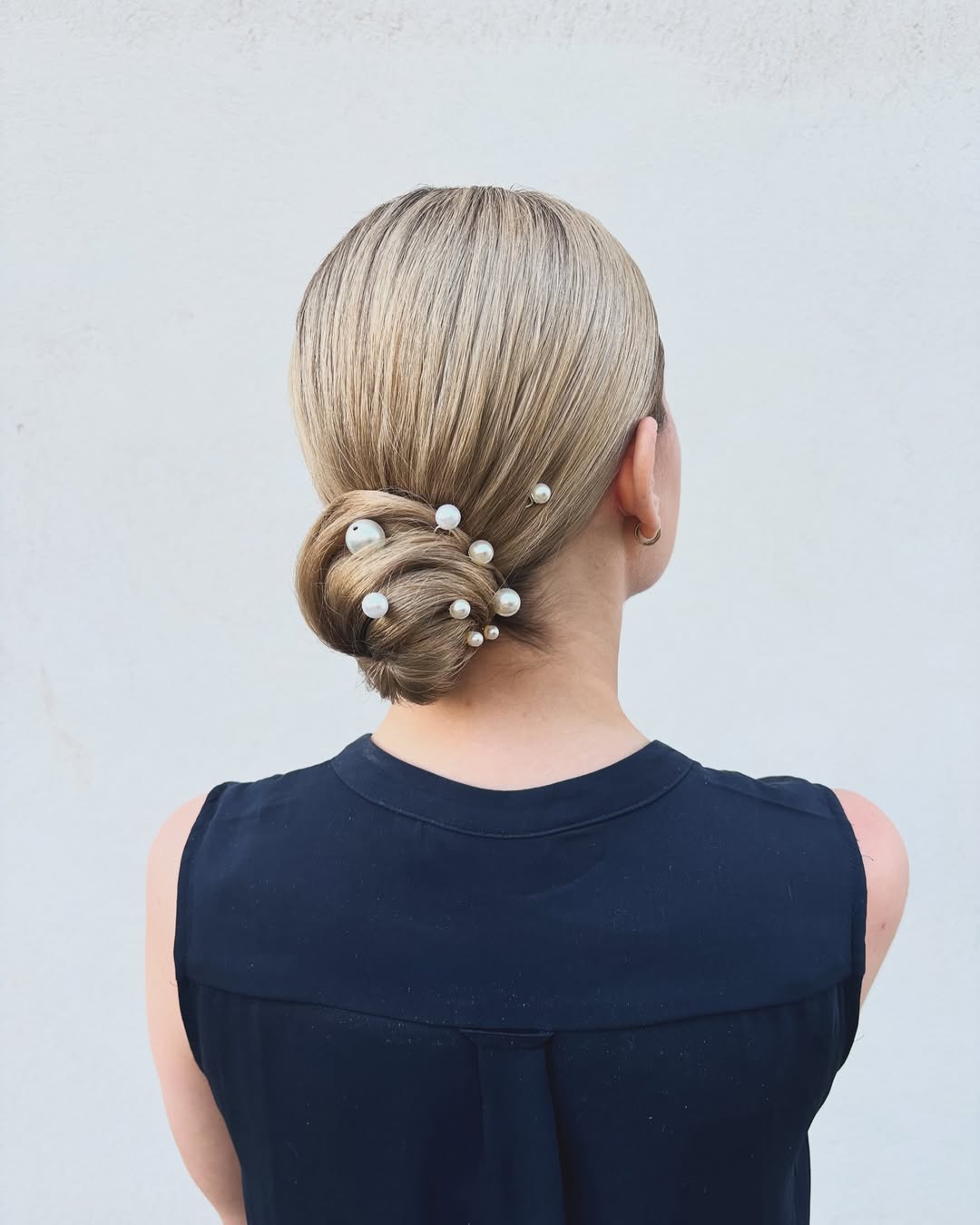 Sleek Blonde Chignon With Pearl Hair Pins