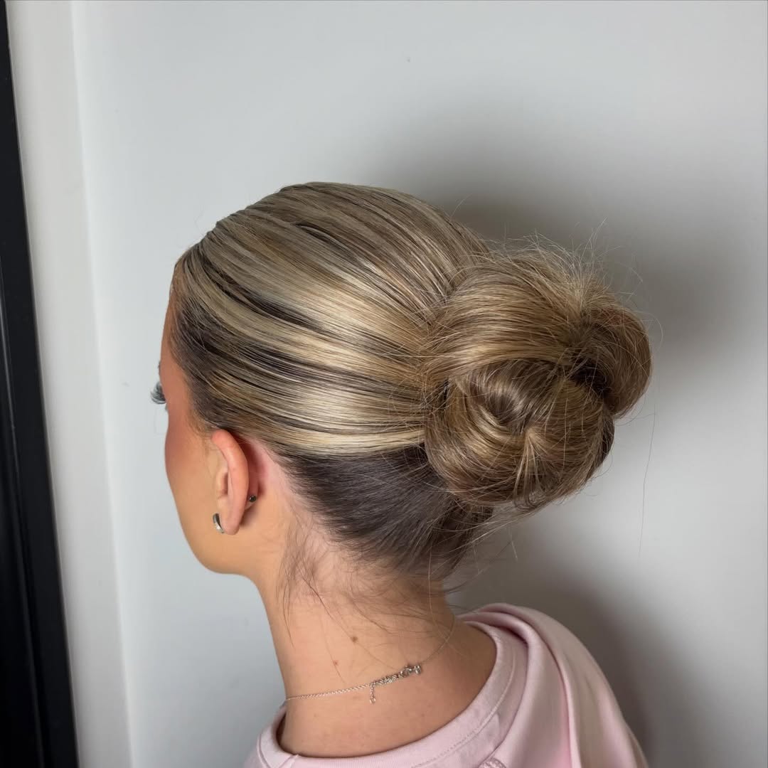 Sleek Blonde Highlighted High Bun Updo