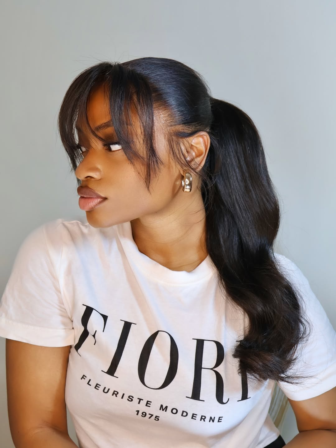 Sleek High Ponytail With Full Face-Framing Bangs