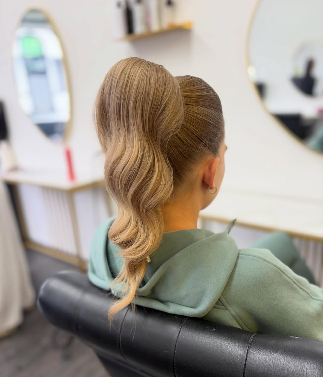 Sleek High Ponytail With Glamorous Hollywood Waves