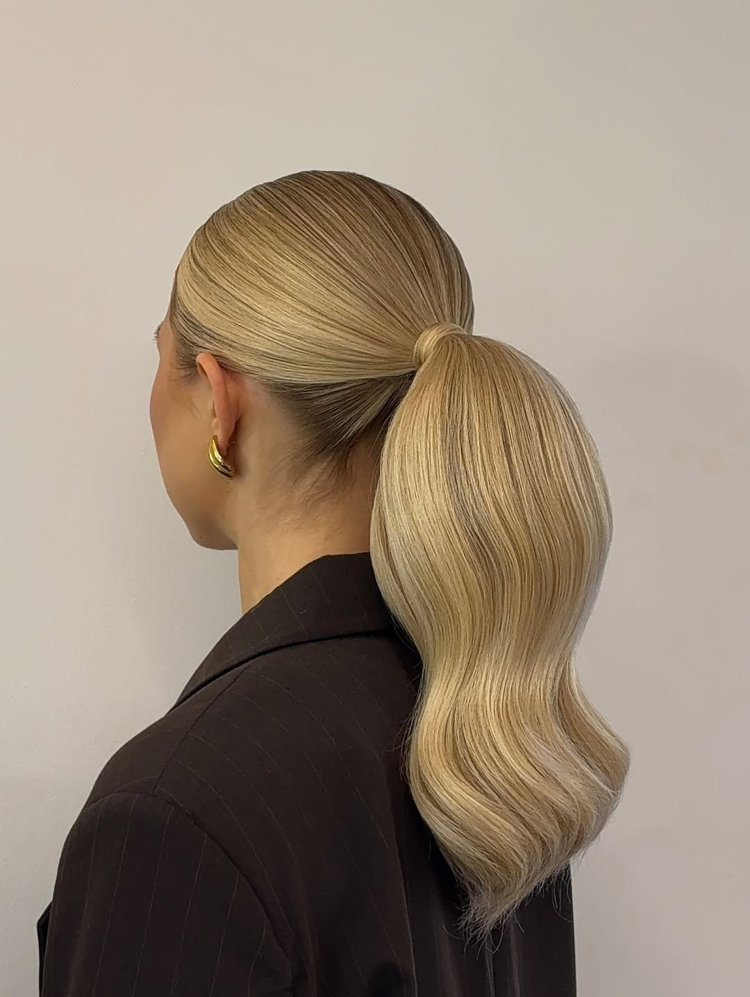 Sleek High Ponytail With Hollywood Waves