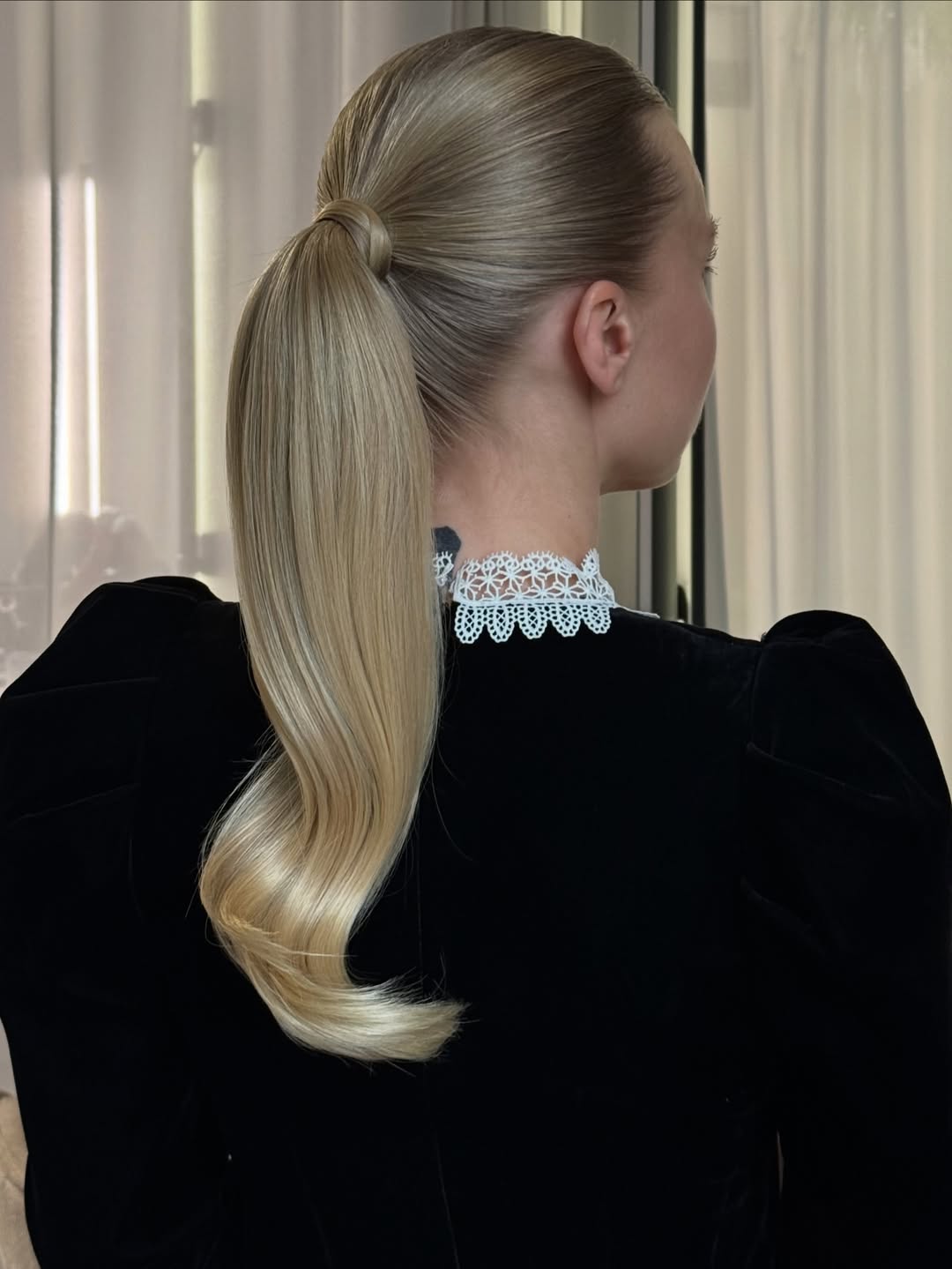 Sleek High Ponytail With Voluminous Curl