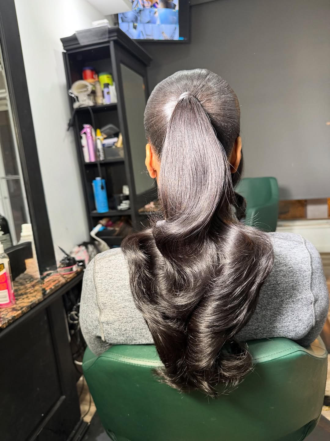 Sleek High Ponytail With Voluminous Curls