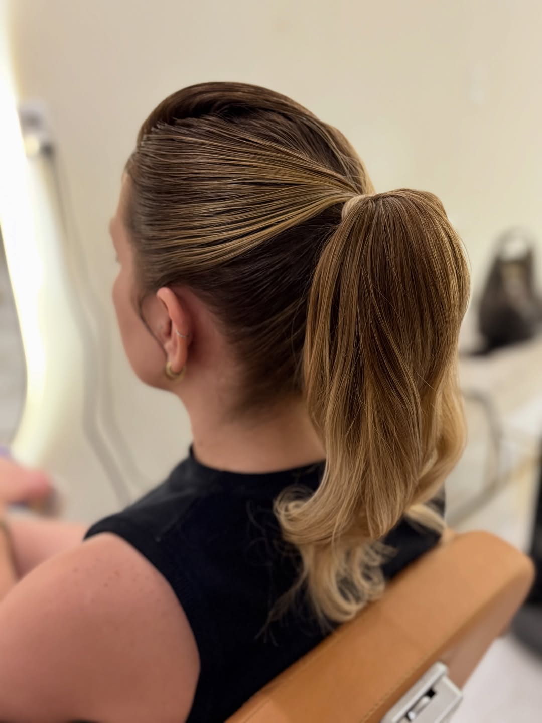 Sleek High Ponytail With Wavy Ends