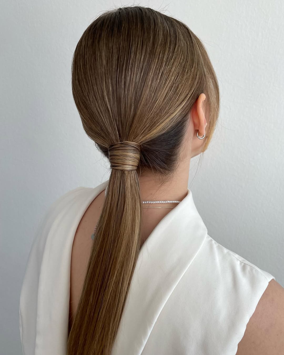 Sleek High Ponytail With Wrap-Around Detail