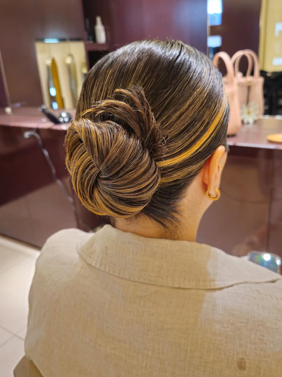Sleek Low Bun With Bold Highlights