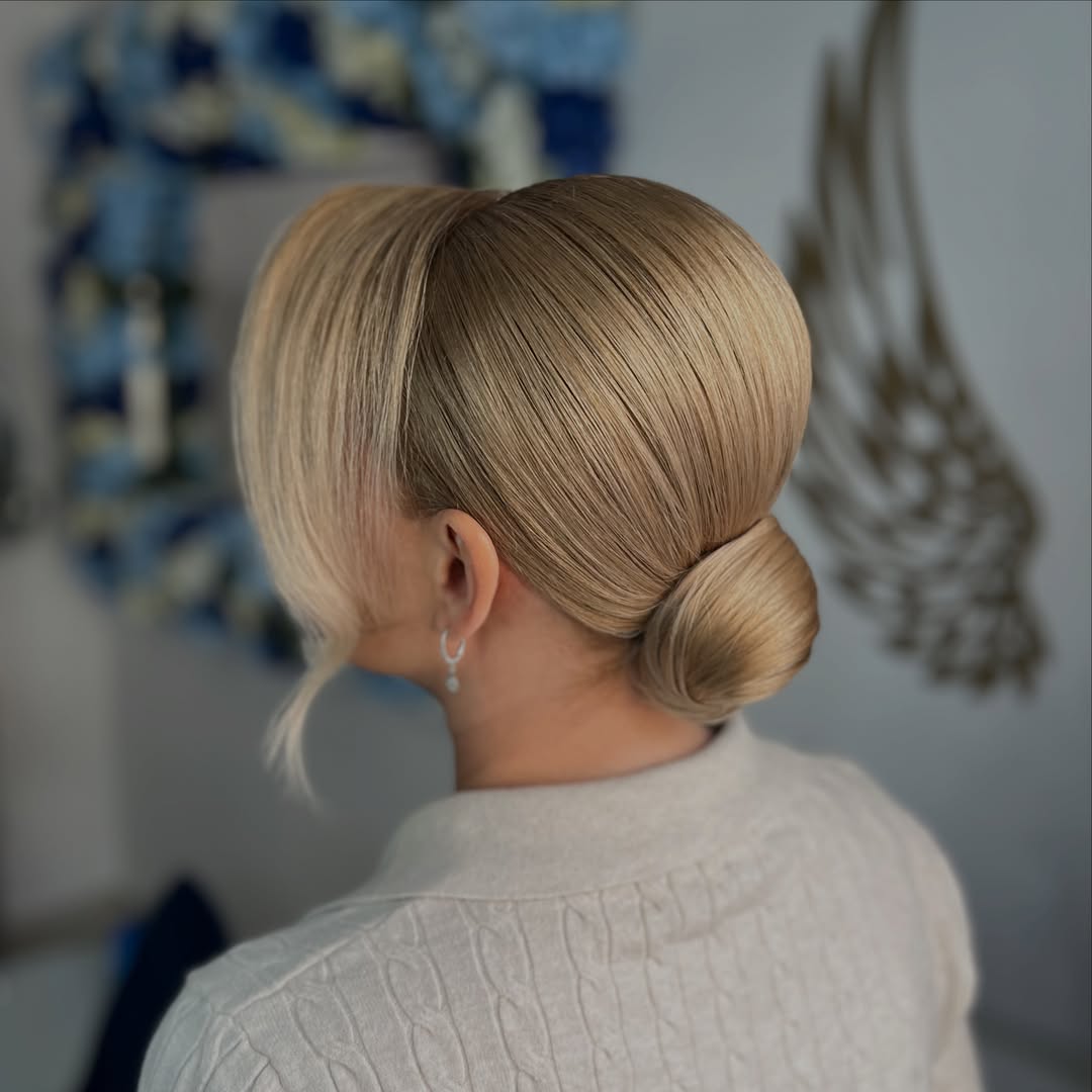 Sleek Low Bun With Face-Framing Layers