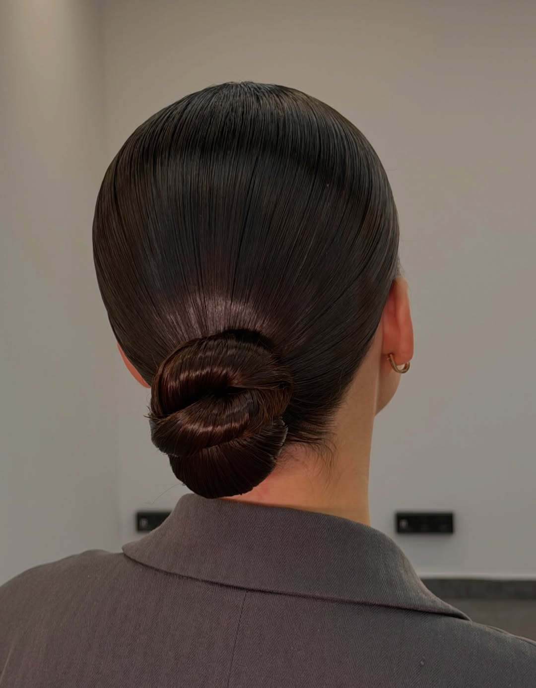 Sleek Low Bun With Glossy Finish