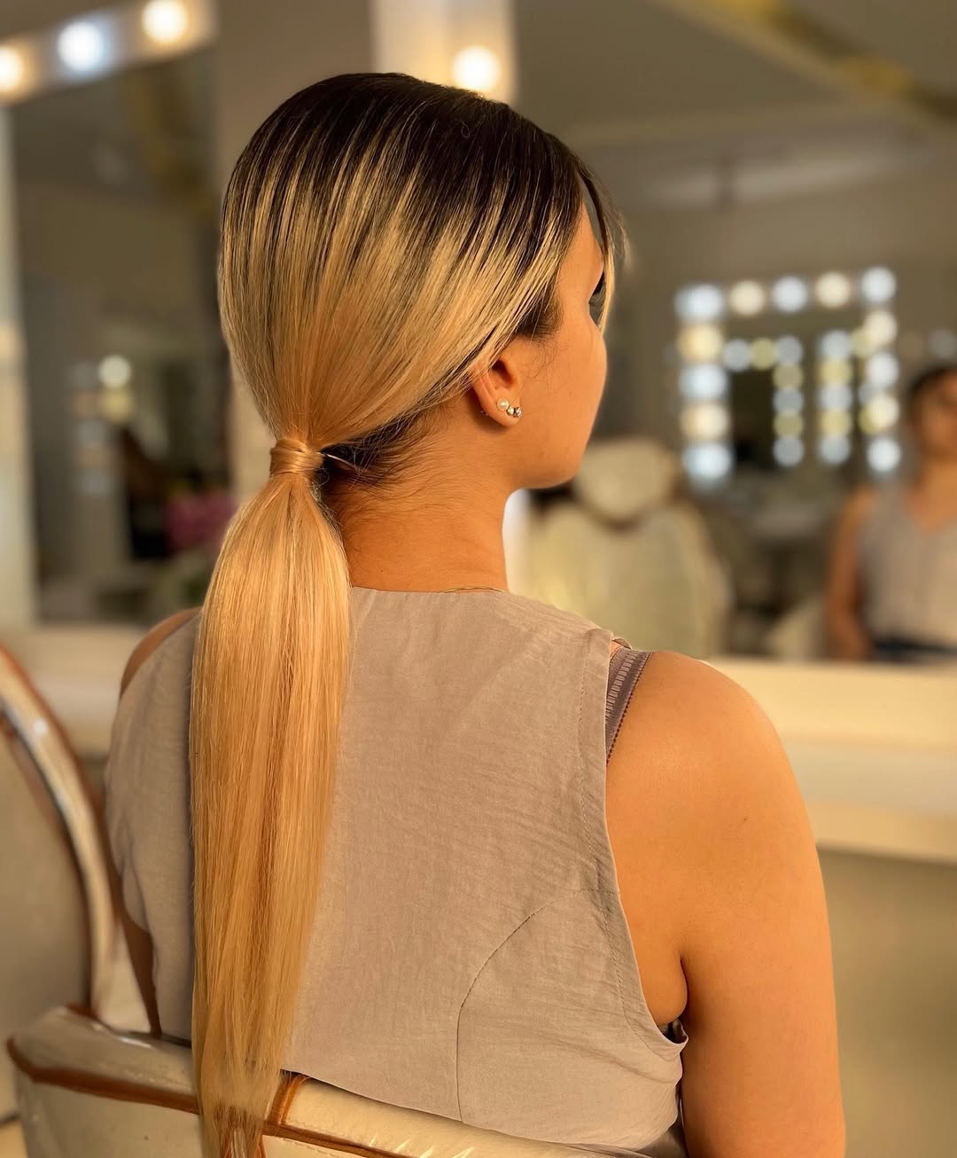 Sleek Low Ponytail With Blonde Balayage And Shadow Root