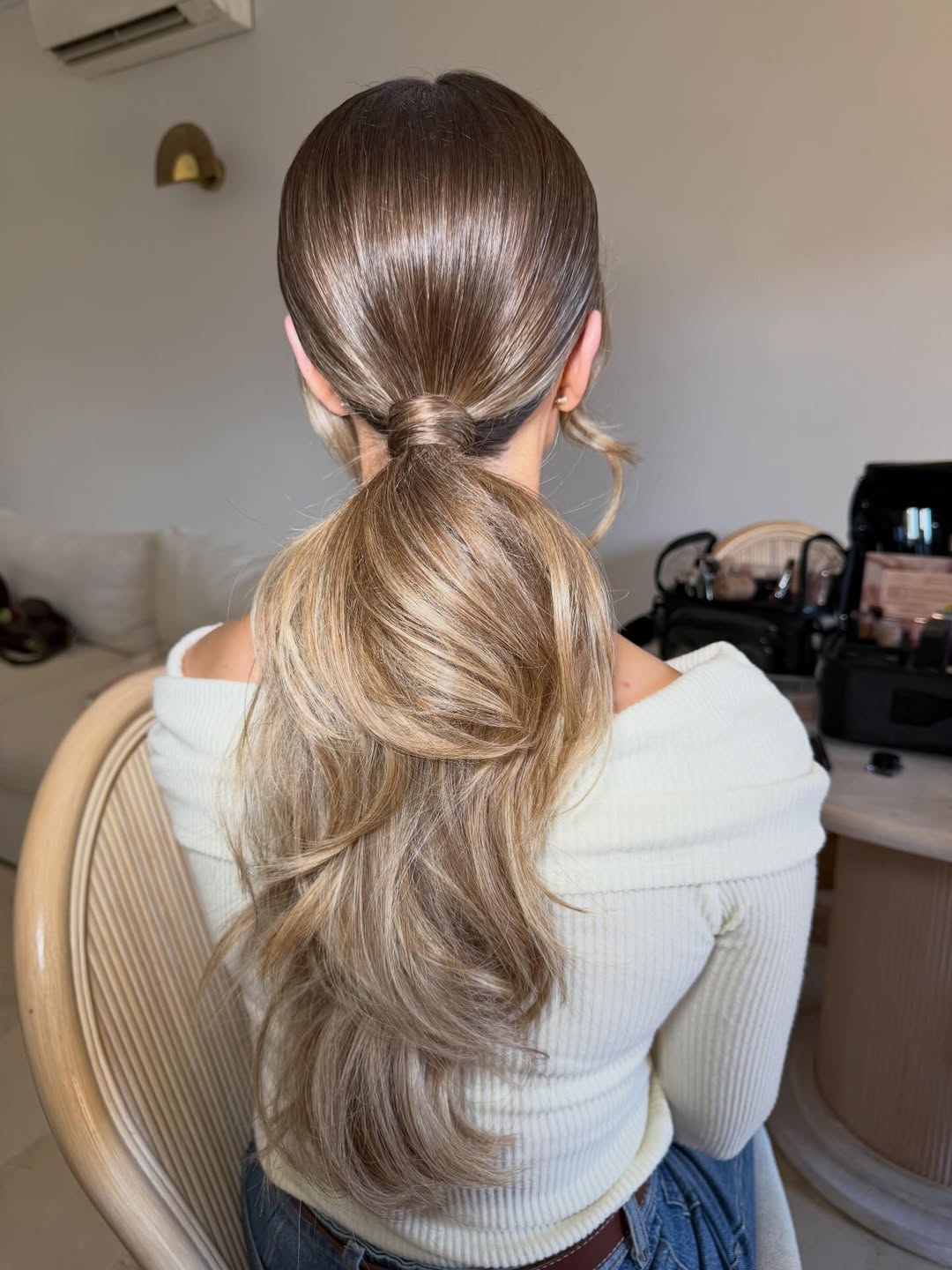 Sleek Low Ponytail With Wavy Honey Blonde Ends