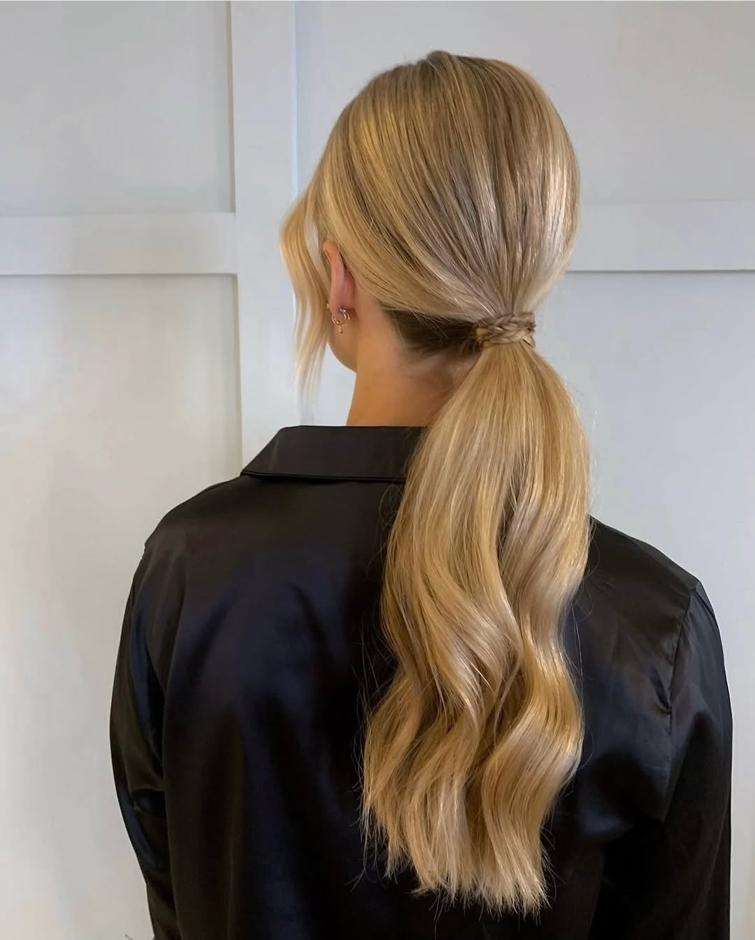 Sleek Low Ponytail With Wavy Honey Blonde Hair