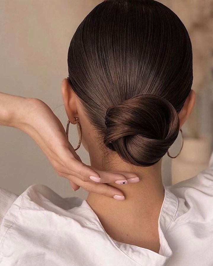 Sleek Low Twisted Bun For A Polished Look