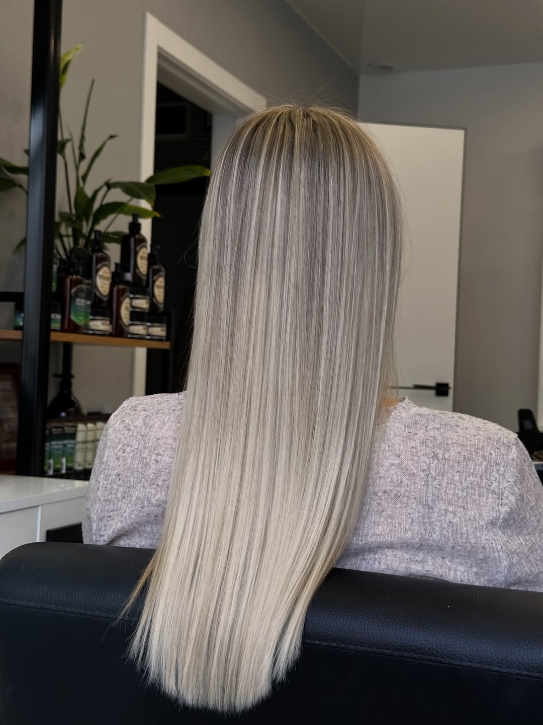Sleek Platinum Blonde Hair With Shadow Root
