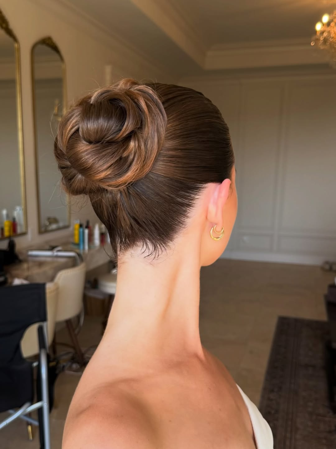 Sleek Professional Low Bun With Brunette Highlights