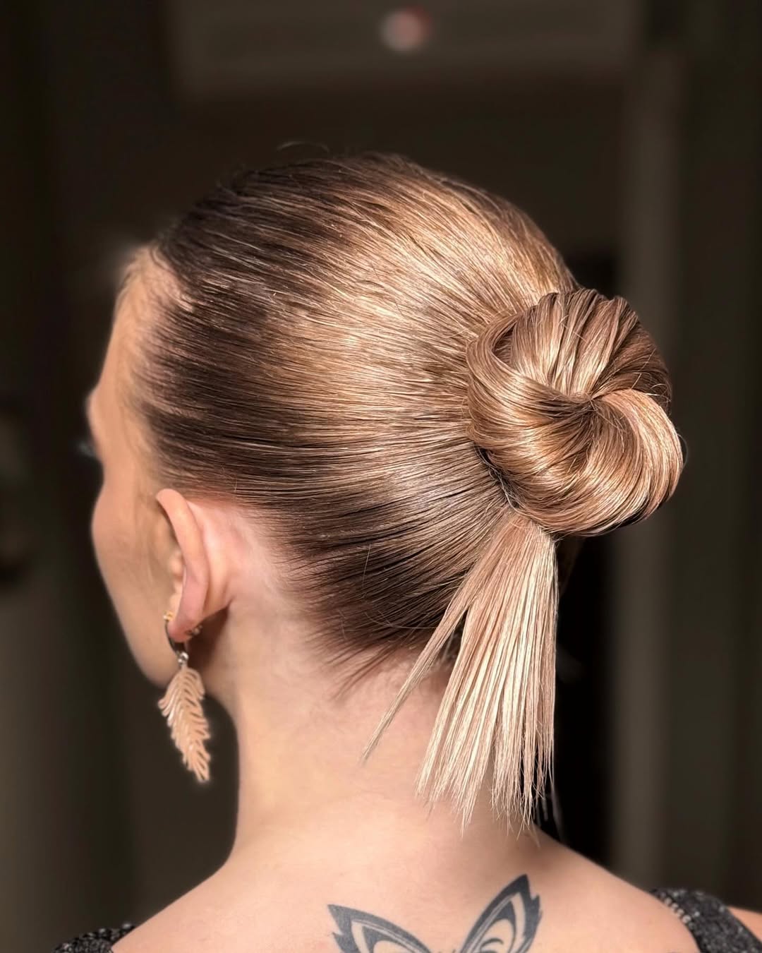 Sleek Twisted Low Bun With Face Framing Pieces
