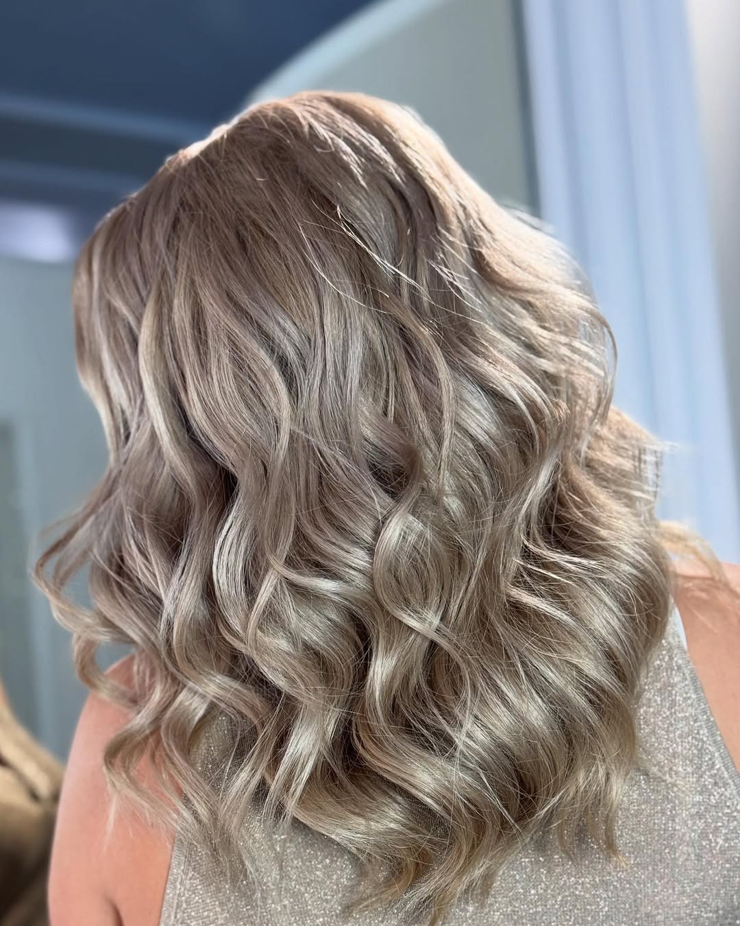 Soft Ash Blonde Waves With Subtle Face Framing