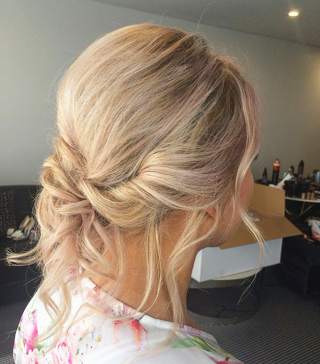 Soft Blonde Updo With Wispy Face-Framing Pieces
