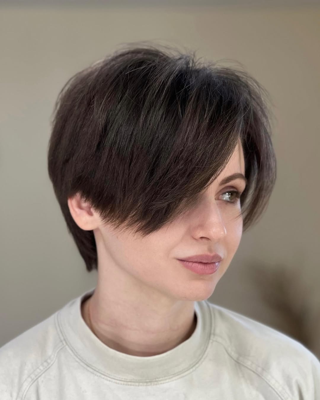 Soft Edgy Dark Brown Pixie Cut With Deep Side Bangs