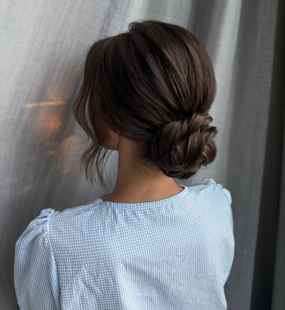 Sophisticated Braided Low Bun with Face-Framing Waves