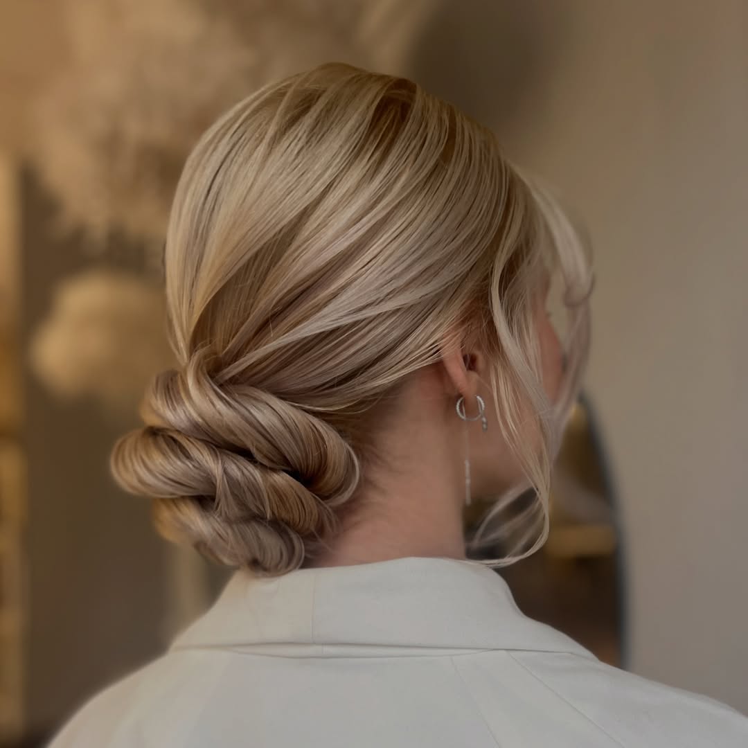 Sophisticated Twisted Low Bun On Blonde Hair