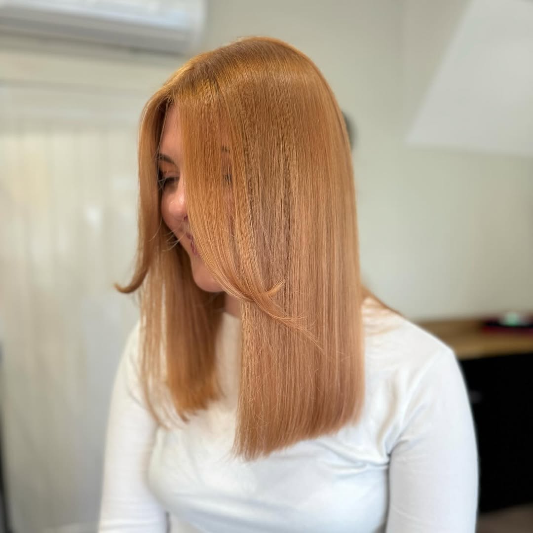 Strawberry Blonde Long Bob with Face-Framing Layers