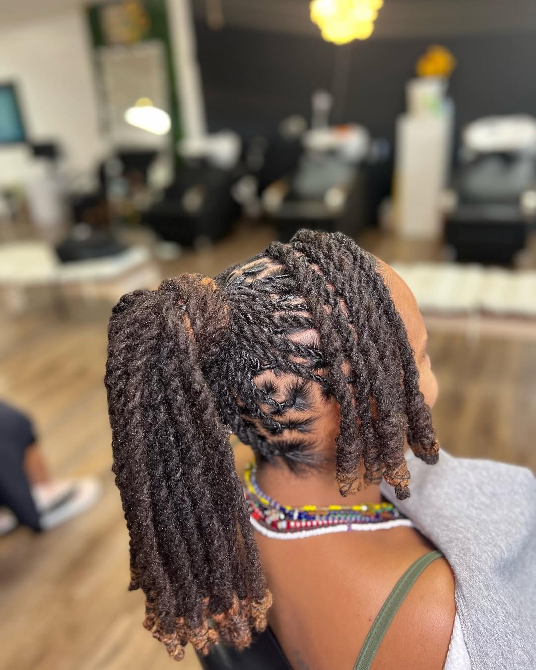 Styled Locs Ponytail With Creative Parting