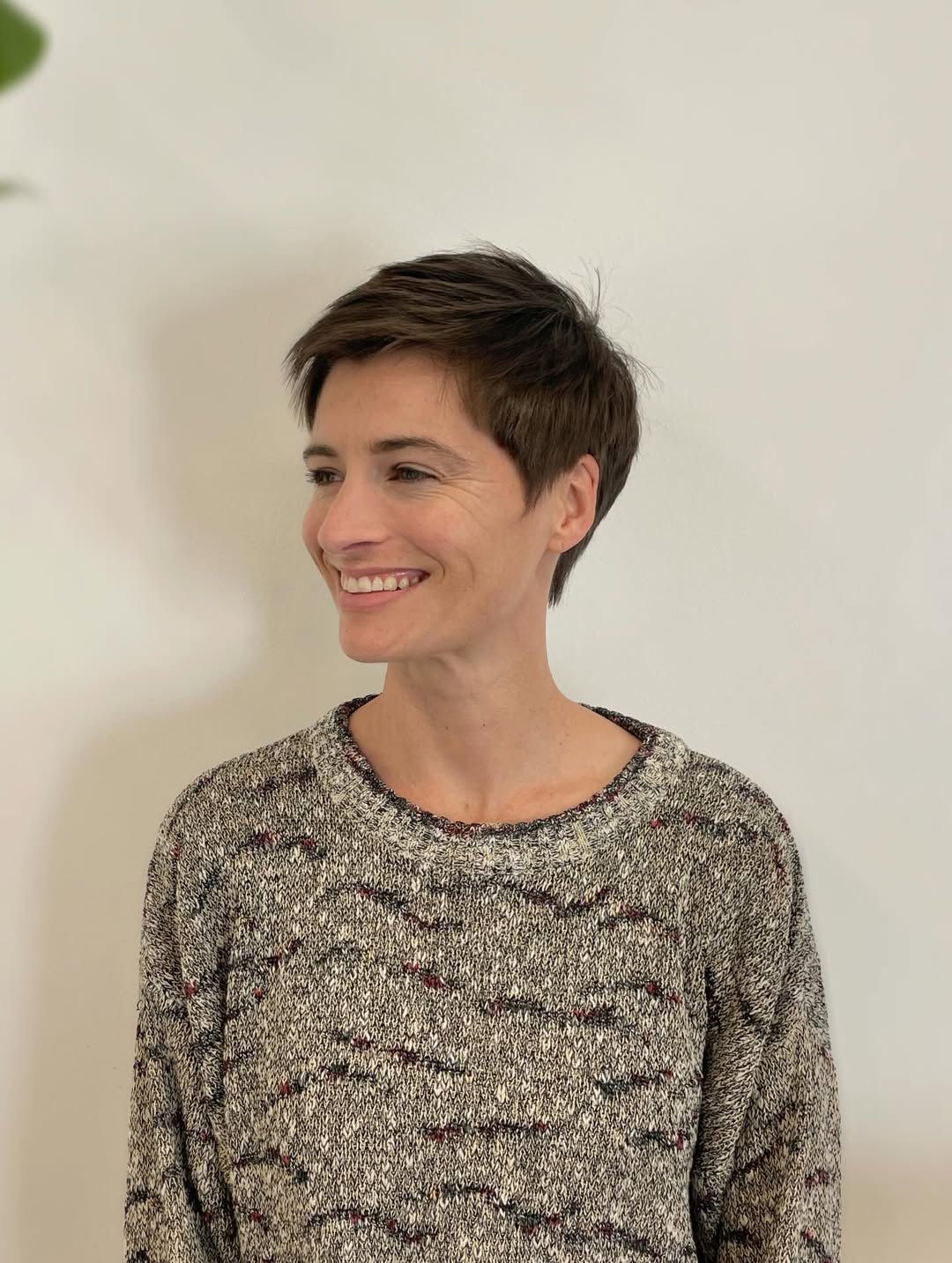 Textured Brunette Pixie With Undercut Sides