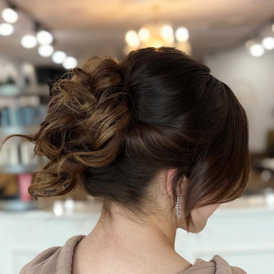 Textured Low Bun With Face-Framing Tendrils