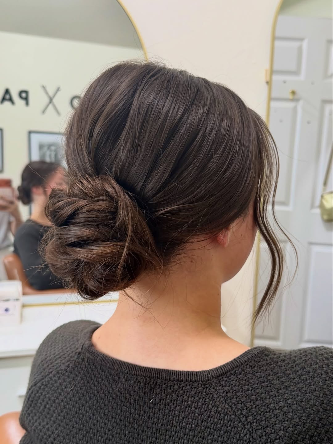 Textured Low Bun With Loose Face-Framing Tendrils