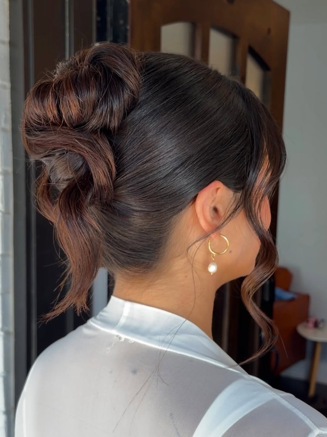 Textured Updo With Face-Framing Tendrils