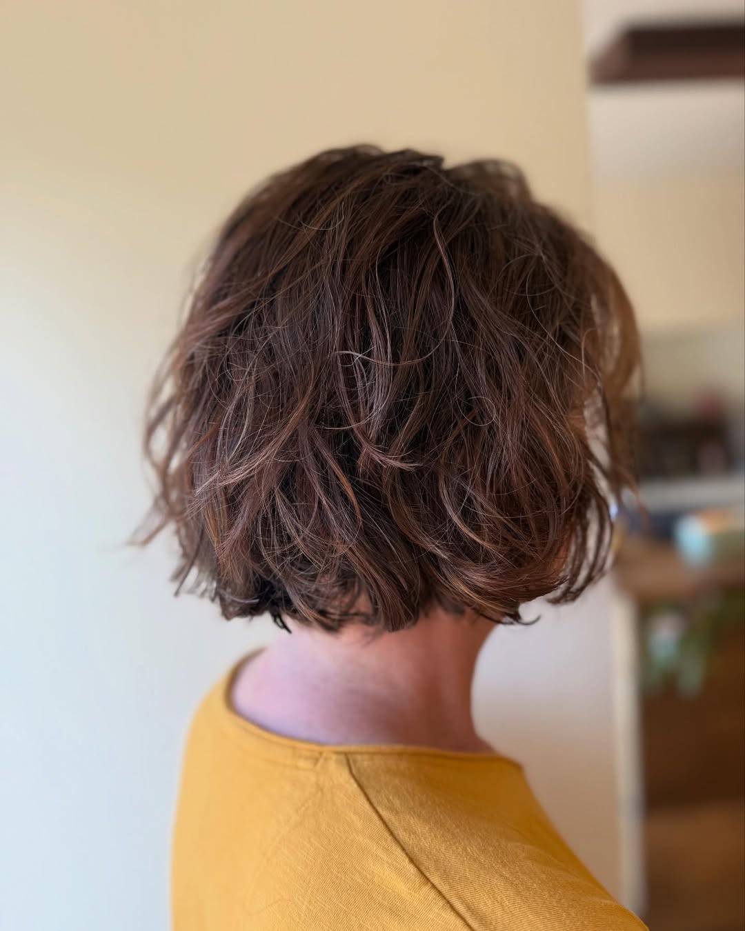 Tousled Layers With Subtle Honey Blonde Highlights