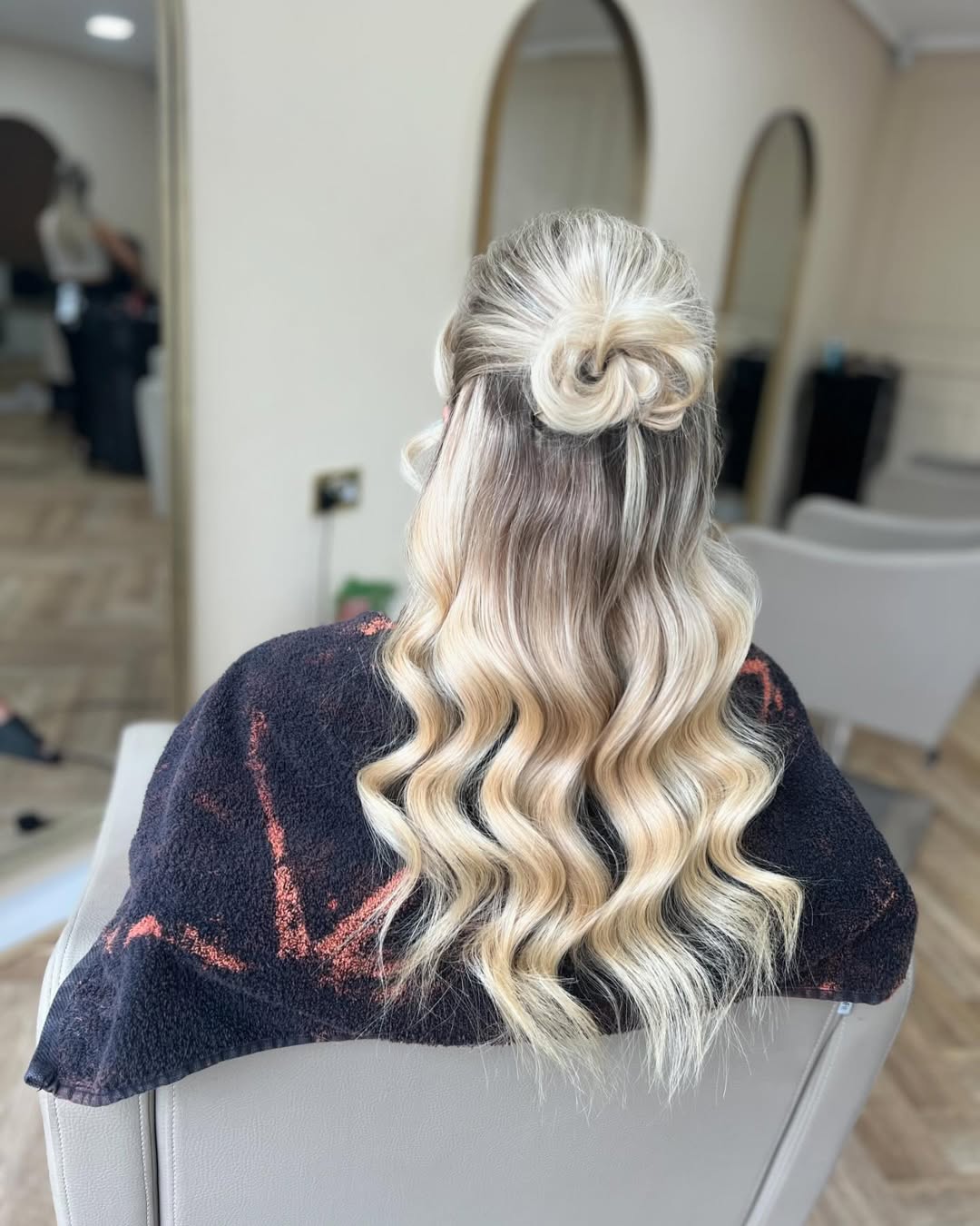 Twisted Half-Up Top Knot With Loose Waves