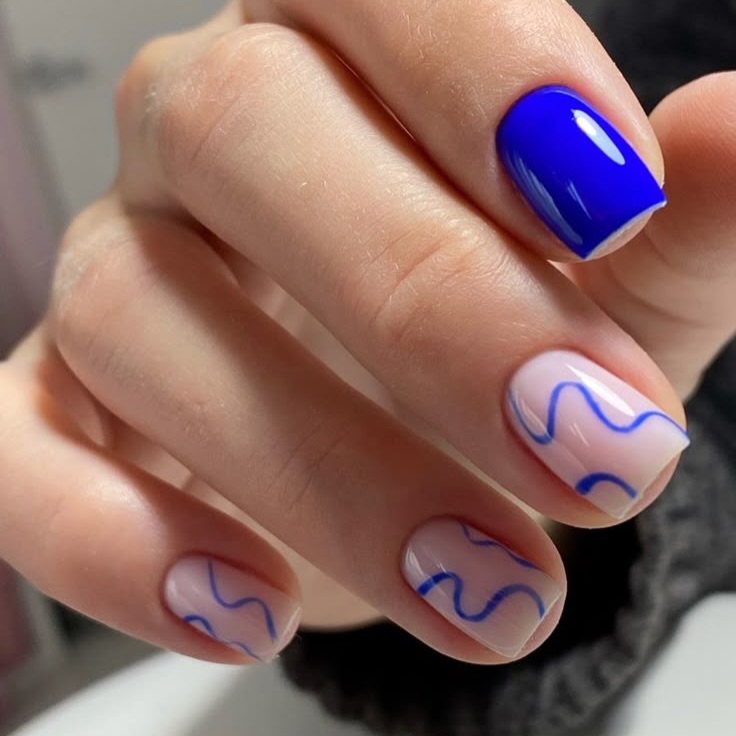 Vibrant Blue Abstract Swirls on Milky Pink Squoval Nails