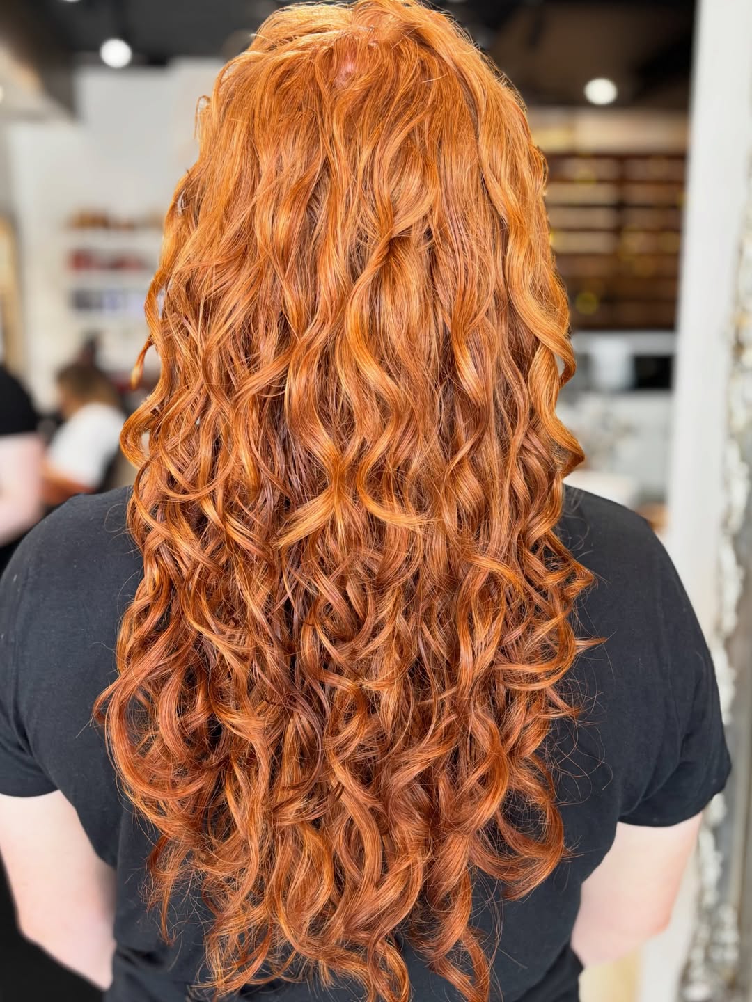 Vibrant Copper Curls With Sun-Kissed Highlights