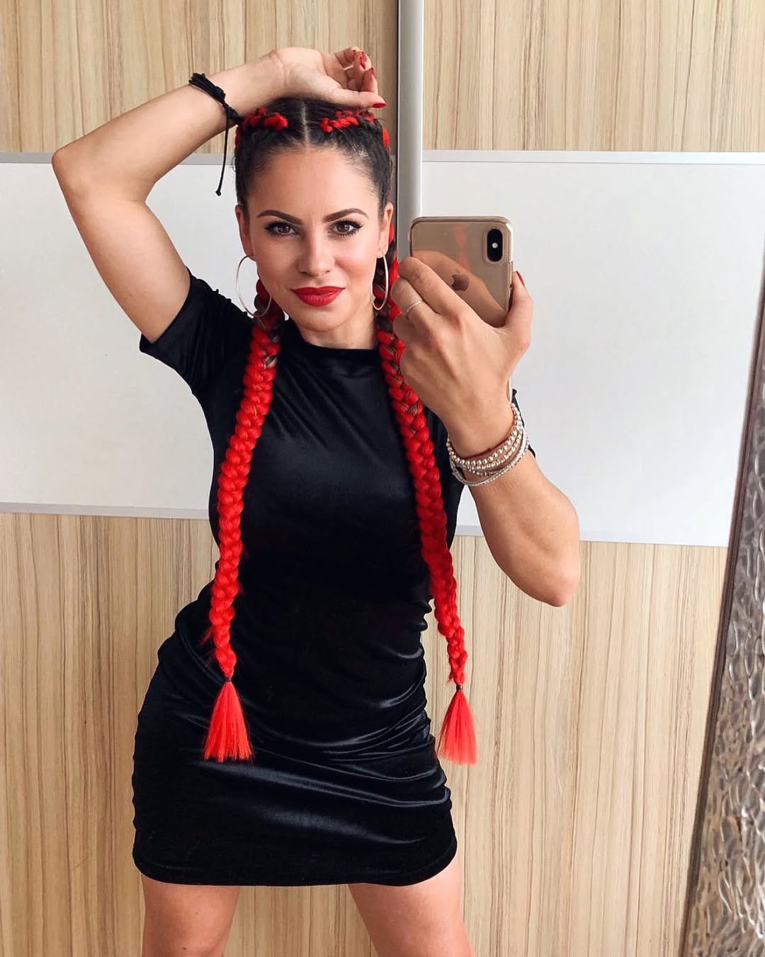 Vibrant Red Braids With Two Knot Buns