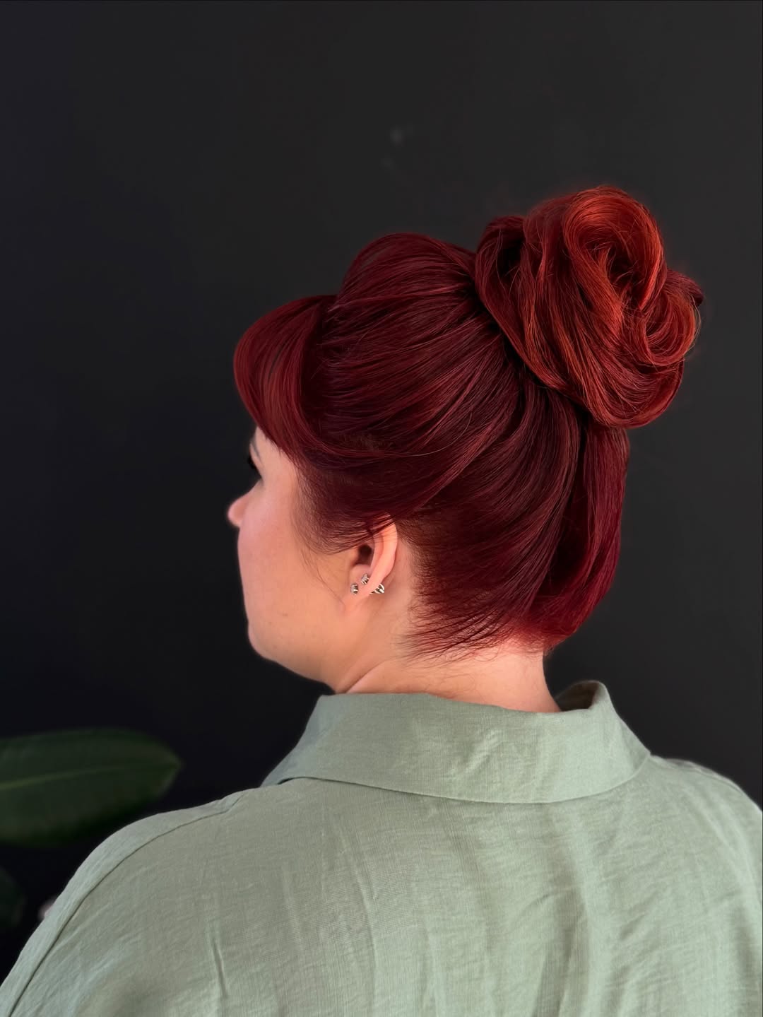 Vibrant Red Updo With Full Bangs