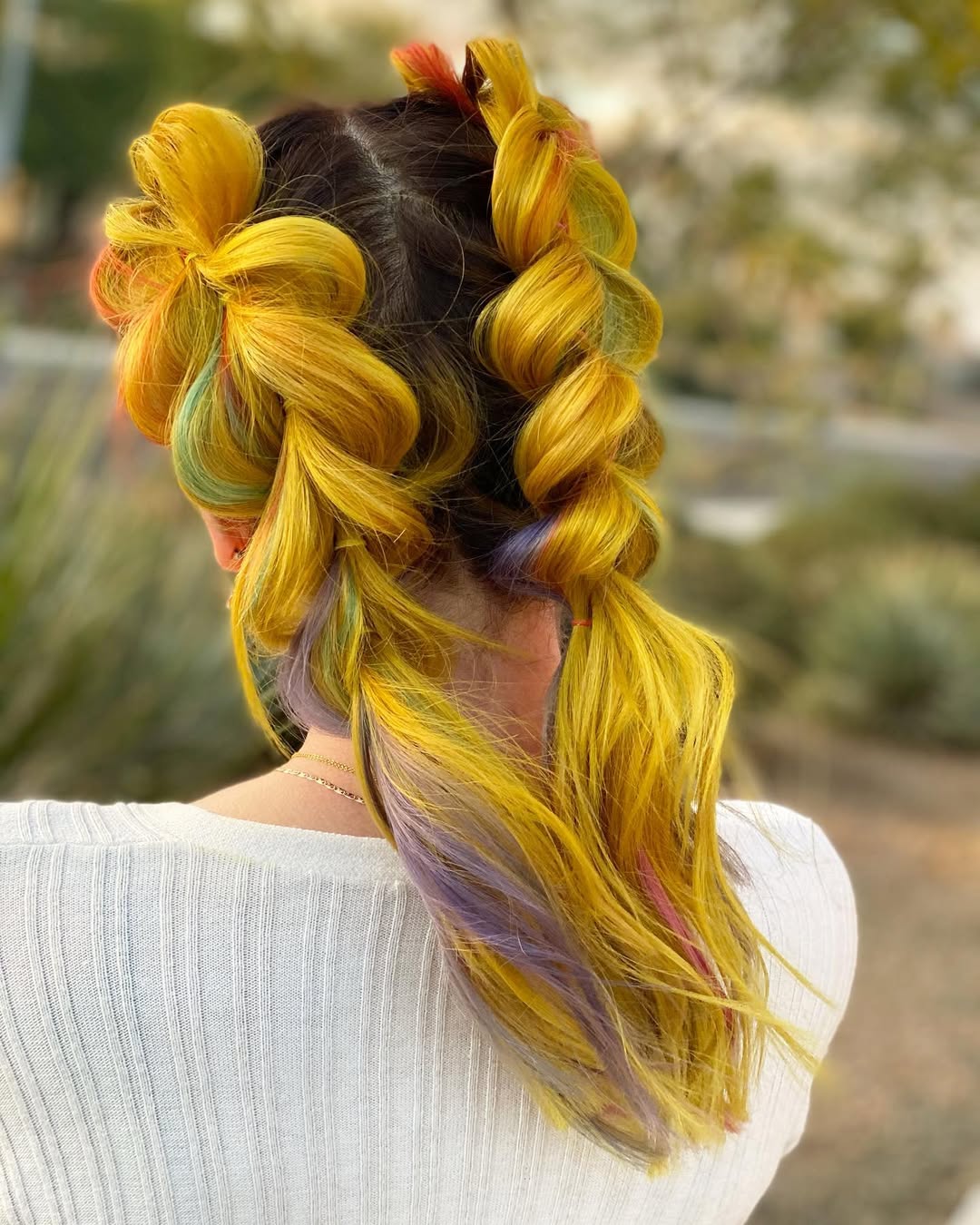 Vibrant Yellow Braids With Hidden Rainbow Streaks