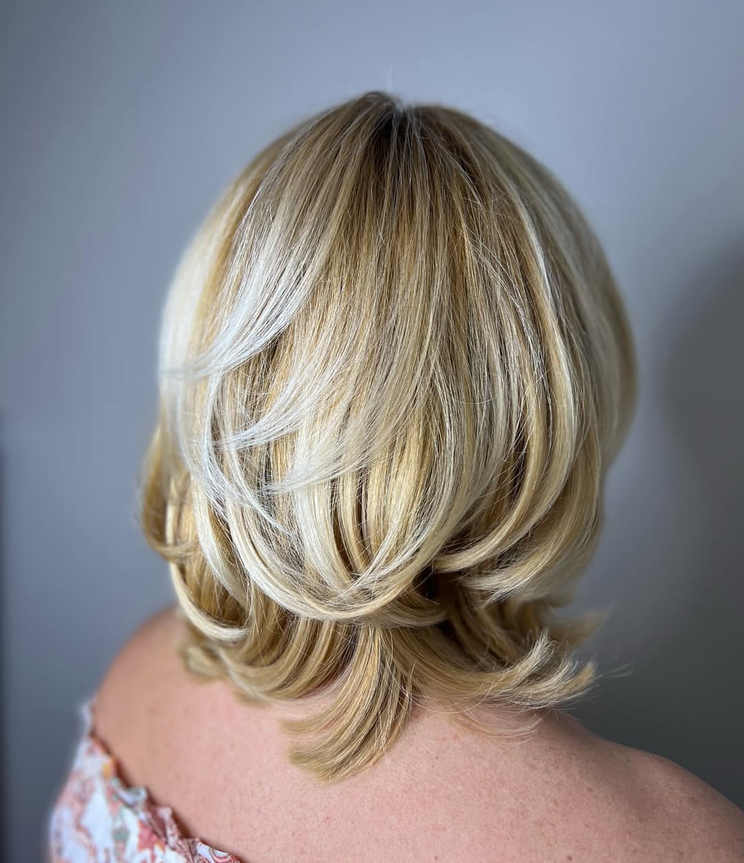 Volume-Filled Feathered Layers Blonde Bob