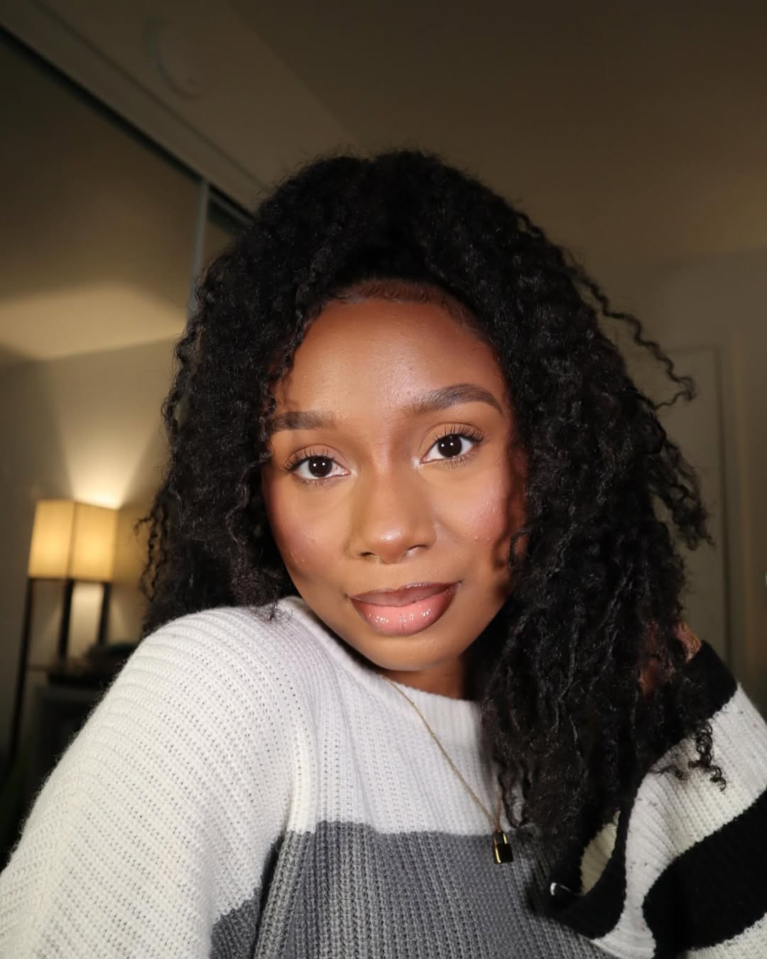 Voluminous Defined Curls With A Half-Up Style