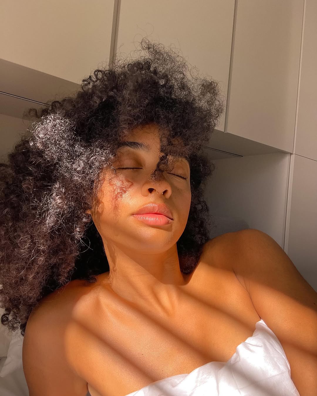 Voluminous Defined Curls With Golden Hour Glow