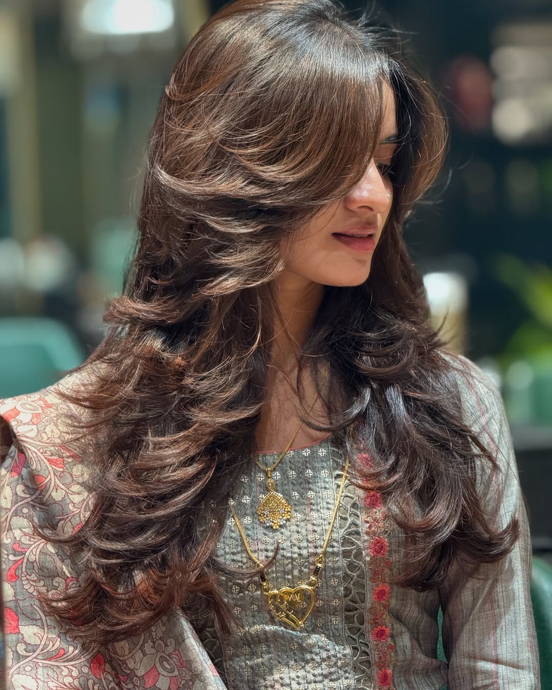 Voluminous Face-Framing Layers With Warm Brown Highlights