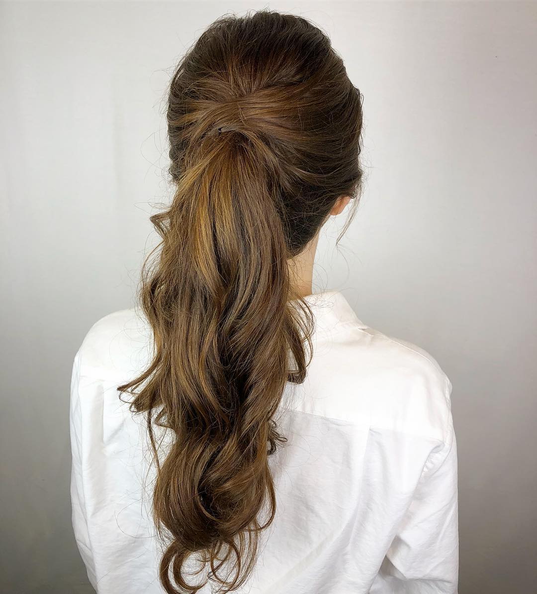 Voluminous Half-Up Ponytail With Loose Waves