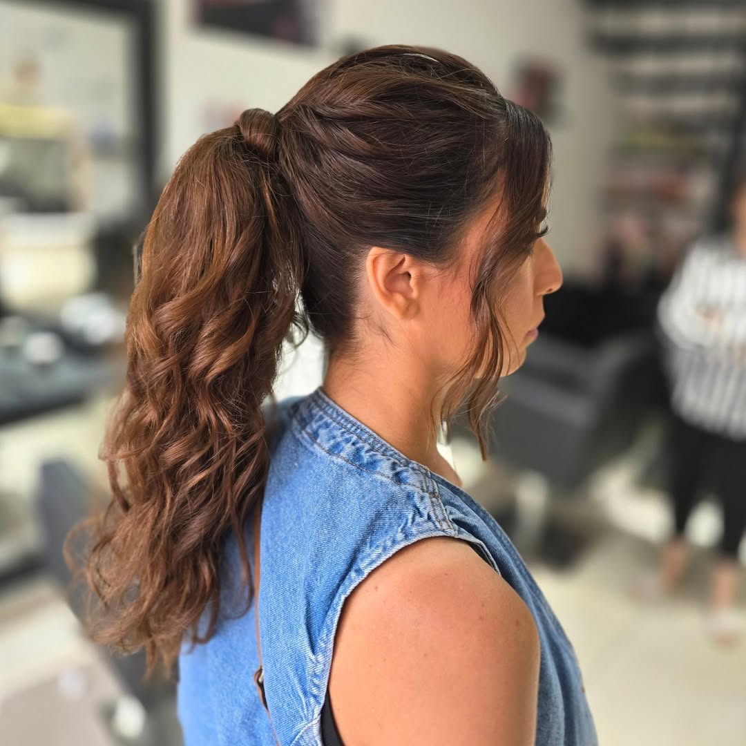 Voluminous Wavy High Ponytail With Face Framing Strands