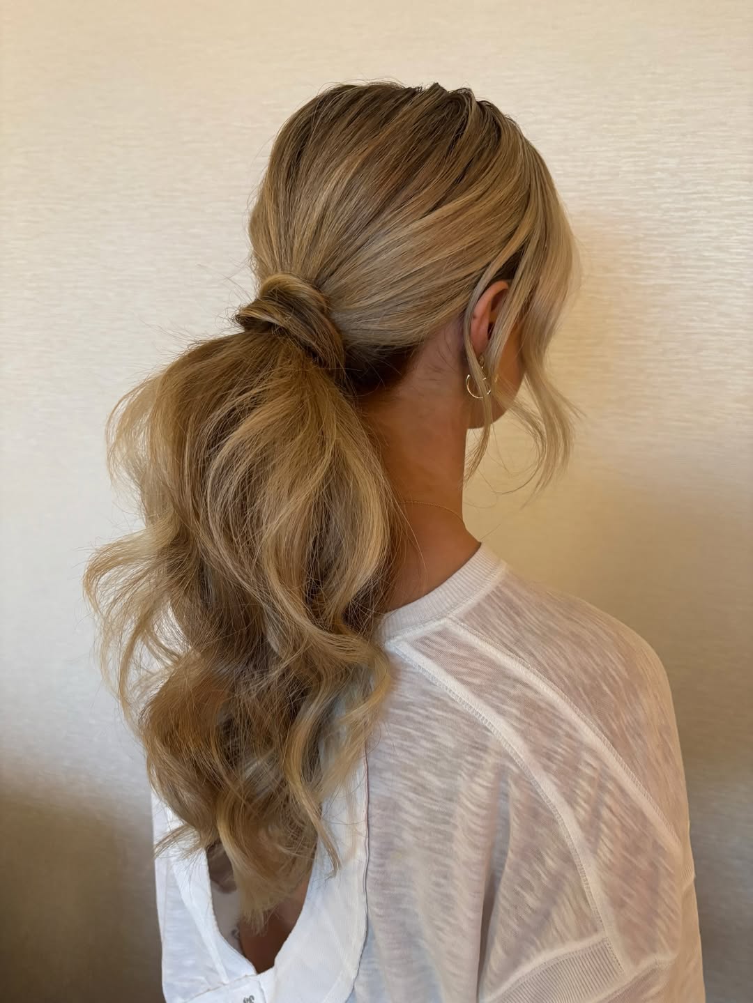 Voluminous Wavy Ponytail With Face Framing Layers