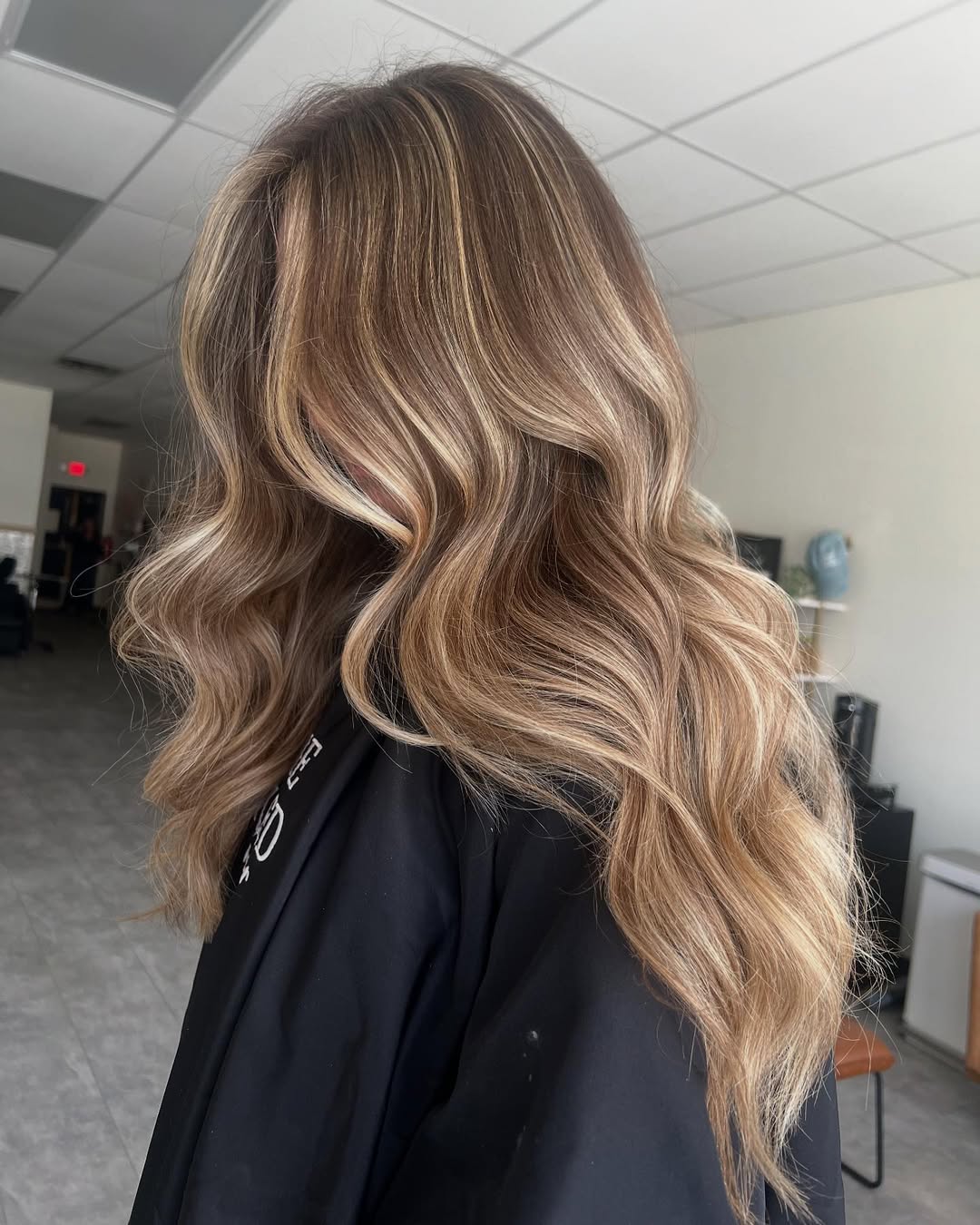 Warm Blonde Balayage With Voluminous Waves